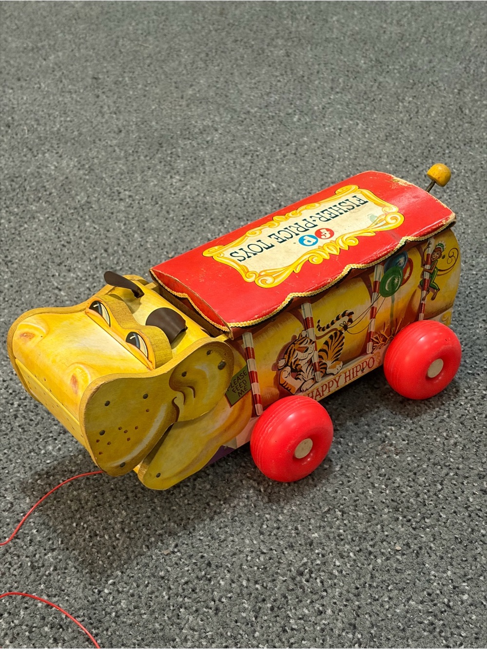 Fisher-Price Yellow Happy Hippo Pull Toy with Red Canopy and Wheels